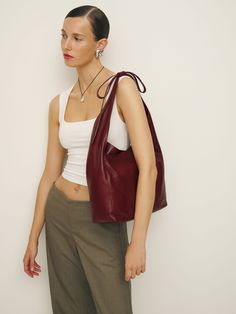 Extra baggage. Shop the Medium Vittoria Bag from Reformation, a slouchy leather tote with a magnetic closure. Reformation Vittoria Tote, Reformation Vittoria Bag, Slouchy Brown Leather Bag, Slouchy Bag Outfit, Slouchy Leather Bag, Reformation Bag, Brown Summer Outfits, Leather Tote Bag Outfit, Brown Bag Outfit