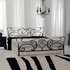 a black and white bedroom with a chandelier