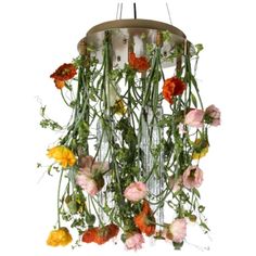 an arrangement of flowers hanging from a chandelier