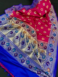 Gorgeous and Rich Saree in Banarasi Handloom Silk with Meenakari and Zari Work Item : Saree Color : Pink and Blue Base Fabric : Banarasi Silk Blouse piece : Yes Blouse material : Banarasi Silk Work : Handloom, Meenakari Work and Tassels Fall & Edging(Pico) Yes/No : Yes Kindly note : Since this Saree is handmade hence little inconsistencies may be there however it is not considered as a defect. Every Saree is unique in its own way and weavers put in there heart and soul in weaving these beaut Traditional Pink Brocade Saree, Eid Dola Silk Traditional Wear With Meenakari, Multicolor Meenakari Dupatta For Festivals, Multicolor Dola Silk Lehenga With Zari Weaving, Multicolor Traditional Wear With Zari Weaving For Navratri, Multicolor Meenakari Dupatta For Puja, Traditional Unstitched Meenakari Saree, Traditional Banarasi Silk Wear With Pallu, Festive Banarasi Silk Traditional Wear With Meenakari