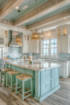 a kitchen with an island and two stools