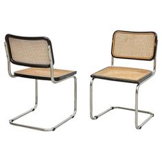 a pair of chairs with woven seats and metal frame legs, designed by thoke