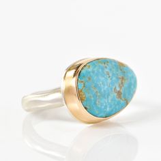 Set in a 14K yellow gold bezel with sterling silver platform Kingman turquoise Middle groovy band Dimensions 0.55 x 0.76" Size 7 Not your ring size? Please add a ring sizing to your cart if you need a different size. Contains natural stone. The appearance of each piece may vary. Unique Yellow Gold Oval Turquoise Ring, Sterling Silver Turquoise Ring In Yellow Gold, Sterling Silver Turquoise Ring With Yellow Gold Gemstone, Turquoise Gemstone Ring In Yellow Gold Sterling Silver, Gold Oval Turquoise Sterling Silver Ring, Gold Oval Turquoise Ring In Sterling Silver, Oval Gold Turquoise Ring In Sterling Silver, Turquoise Ring With Bezel Setting For Anniversary, Anniversary Turquoise Ring With Bezel Setting