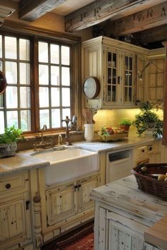 a kitchen with an old fashioned sink and wooden cabinets