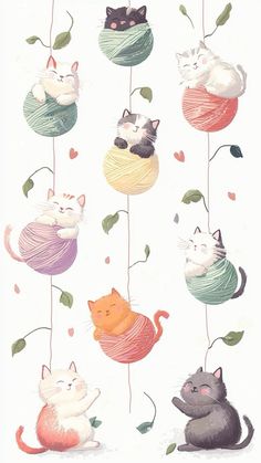 an image of cats hanging from strings with leaves on the top and one cat laying down