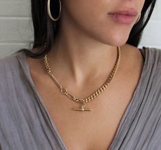 "Curb Gold This is a beautiful super trendy necklace for layering and for everyday wear. * DETAILS * ✤ Available in 14k Gold plated over brass ✤ Model is wearing size 16\" ✤ Toggle bar hang as a charm ✤ Available in Size 16\" 18\" and 20\" * PACKAGING * - Purchase is packaged in a Tommassini Jewelry box. - If you purchase more than one item, I will place it all into one box, unless requested otherwise in a note. * DON'T FORGET US * Instagram: https://instagram.com/tommassini_jewelry Facebook: ht Yellow Gold Metal Chain Necklace With Curb Chain, Luxury Gold-tone Chain Necklace With Chunky Chain, Gold-tone Curb Chain Link Necklace, Gold-plated Gold Curb Chain Necklace, Gold Necklace Long, 14k Yellow Gold Curb Chain Rope Necklace, Chunky Gold Necklace, Chunky Gold Necklaces, Chunky Chain Necklace