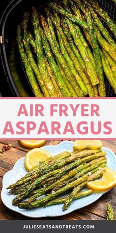 air fryer asparagus on a plate with lemon wedges next to it