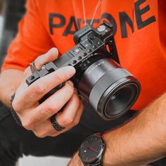 a man holding a camera in his hands