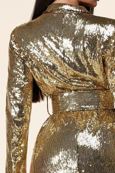 𝑫𝒆𝒔𝒄𝒓𝒊𝒑𝒕𝒊𝒐𝒏: Gold Sequins Mini Dress features a collared neckline and long sleeves with button cuffs. A relaxed bodice with two buttoning top flap pockets falls to a banded waist, atop a mini A-line skirt with oversized utility-inspired pockets. An exposed, function Model wearing size Small 𝑺𝒊𝒛𝒆 𝑪𝒉𝒂𝒓𝒕: • 2-4 Small • 6-8 Medium • 10-12 Large 𝑺𝒉𝒊𝒑𝒑𝒊𝒏𝒈 • This Item ships for free. 𝑹𝒆𝒕𝒖𝒓𝒏𝒔 • Returns (For store credit only) accepted within 30 days after your package Winter Party Mini Dress With Button-up Front, Gold Long Sleeve Winter Dress, Gold Long Sleeve Dress For Winter, Gold Long Sleeve Mini Dress For Fall, Long Sleeve Party Dress With Button Closure, Formal Long Sleeve Mini Dress For Fall, Long Sleeve Mini Dress For Party Season, Gold Sequined Long Sleeve Dress, Gold Sequined Mini Dress For Fall