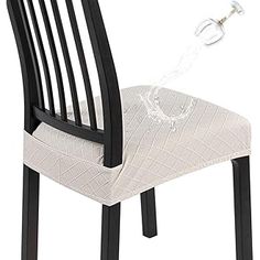 a black and white chair with a glass on it's backrest, in front of a white background