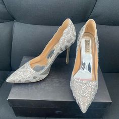 Worn Only Once To A Wedding, In Excellent Shape! Come With It’s Own Box. Stores Has It Listed As Ivory Color, I’d Say It’s On The Gray Side. Designer Silver Wedding Heels, Silver Heels With Rhinestones For Reception, Silver Sequined Heels For Wedding, Silver Glamorous Heels For Reception, Elegant Silver Heels For Reception, Silver Embellished Wedding Shoes For Gala, Designer Rhinestone Heels For Wedding, Glamorous Silver Heels For Reception, Designer Wedding Heels With Rhinestones