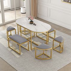 a dining table with four chairs and a bench in front of it on a rug