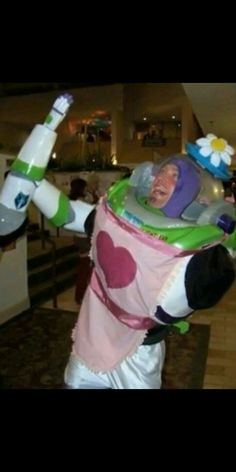 a man dressed as buzz lightyear from toy story