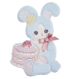 a blue teddy bear with a pink cake on it's lap sitting in front of a white background