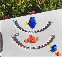 an open book that has some different items on top of it with the words nemo and dory