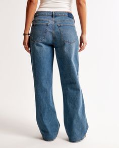 Our Curve Love low rise baggy jeans in a medium wash with a clean hem. This fit features a 8.5” low rise, is slightly relaxed at waist and hips, and eases at the thigh into a baggy, full-length leg shape. We recommend buying your true size for a baggier fit. Size down for a closer fit. The viral fit that eliminates waist gap: Curve Love features additional room through the hip and thigh for curve-hugging comfort. This jean is made from our vintage stretch fabric which features both an authentic Dark Wash Relaxed Fit Mid-rise Flare Jeans, Medium Wash High Rise Relaxed Fit Flare Jeans, Mid-rise Medium Wash Relaxed Fit Flare Jeans, Everyday Medium Wash Full-length Flare Jeans, Everyday Medium Wash Full Length Flare Jeans, Mid-rise Washed Flare Jeans With Relaxed Fit, Mid-rise Washed Relaxed Fit Flare Jeans, Relaxed Fit Denim Flare Jeans With Standard Cut Leg, Relaxed Fit Denim Flare Jeans