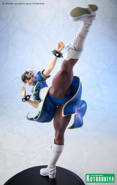 a figurine is posed as a cheerleader