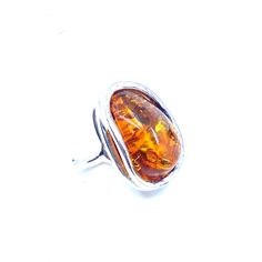 So shiny and sparkling! Silver layered setting for an extra touch! Stones: Cognac Baltic Amber SKU: AMRG020624-05 Dimensions: 1" long x 3/4 "wide x 1/2" depth Sizes adjustable 7.5 to 9 Material: .925 Sterling Silver Made In: Poland Adjustable Sterling Silver Ring With Amber Color, Adjustable Sterling Silver Amber Ring, Adjustable Sterling Silver Rings In Amber, Adjustable Amber Cabochon Rings, Adjustable Oval Amber Ring, Adjustable Amber Open Ring, Adjustable Cabochon Ring For Formal Occasions, Adjustable Cabochon Rings For Formal Occasions, Statement Pendant