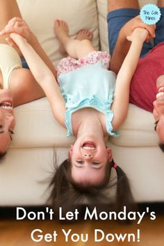 three children laying on the floor with their hands up in the air and one child is upside down