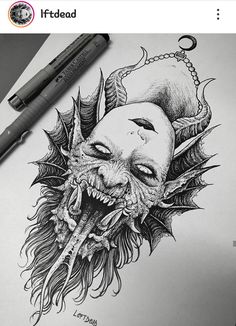 an ink drawing of a demon head with horns and fangs on it's face