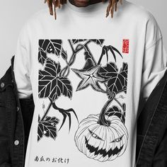 The Halloween pumpkin Tshirt features a spooky streetwear design with a Japanese graphic, perfect for fall events. This oversized unisex T shirt combines festive style with comfort. 𝗗𝗘𝗧𝗔𝗜𝗟𝗦 - Side seams for structural support - Ribbed knit collar for shape retention - Shoulder tape for stability - Made with 100% lightweight cotton for breathability - Retail fit for casual and semi-formal settings 𝗖𝗔𝗥𝗘 𝗜𝗡𝗦𝗧𝗥𝗨𝗖𝗧𝗜𝗢𝗡𝗦 - Machine wash: cold (max 30C or 90F) - Non-chlorine: bleac Urban Halloween T-shirt For Streetwear, Halloween Anime Print Grunge T-shirt, Urban T-shirt With Screen Print For Fall, Urban Graphic Design T-shirt For Fall, Harajuku Style Cotton T-shirt For Fall, Harajuku Graphic Print T-shirt For Fall, Grunge Graphic T-shirt For Fall, Fall Grunge Streetwear T-shirt, Oversized Graphic T-shirt For Fall