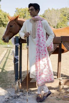 Ivory kasundi kurta embroidered with marodi dabka work on yoke. Comes with printed dushala with marodi work border and plain churidar. - Aza Fashions White Salwar Kameez With Dabka For Traditional Ceremonies, White Dabka Salwar Kameez For Traditional Ceremonies, Traditional White Naqshi Dupatta, White Chanderi Traditional Wear With Naqshi, Dupatta With Naqshi For Traditional Ceremonies, White Traditional Wear With Naqshi On Straight Kurta, White Dabka Churidar For Traditional Ceremonies, White Traditional Wear With Naqshi Embroidery, Traditional Naqshi Dupatta For Ceremonies