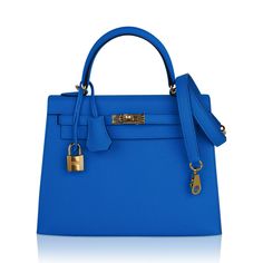 Guaranteed authentic exquisite Hermes Kelly 25 Sellier bag featured in richly saturated Bleu Frida.This exotic Hermes Kelly bag colour is a beautiful year round neutral.Accentuated with gold hardware and epsom leather. Comes with signature Hermes orange box, raincoat, shoulder strap, sleepers, lock, keys and clochette.NEW or NEVER WORN.The Hermes Kelly 25cm bag price retains its value due to the high demand of this limited style.Mightychic has offered exquisite Hermes selections for 22 years mat Gold Epsom Leather Bag With Branded Hardware, Gold Bag With Palladium Hardware In Epsom Leather, High-end Gold Epsom Leather Bag, Gold Epsom Leather Bag With Gold-tone Hardware, Gold Epsom Leather Bag For Everyday Luxury, Timeless Gold Epsom Leather Bag, Chic Epsom Leather Bag With Lock, Epsom Leather Bags With Lock For Everyday Use, Evening Bags With Lock In Epsom Leather