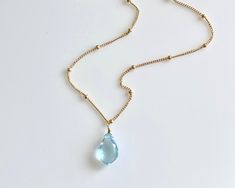 Blue Topaz Necklace, December Birthstone, Blue Teardrop Necklace, Minimalist Layering Jewelry in Gold or Silver, Blue Christmas Gift for her This handmade necklace features a genuine Blue Topaz teardrop suspended from a delicate 14k Gold Filled or Sterling Silver satellite chain. This is a 100% natural blue topaz and full of healing properties. This necklace is simply perfect for everyday wear and is perfect for layering with other pieces in your collection. Blue Topaz is one of December's birth Blue Teardrop Necklace, December Birth Stone Jewelry, December Jewelry, December Birthstone Necklace, December Birthstone Jewelry, Layering Jewelry, Halloween Things, Topaz Birthstone, Blue Topaz Necklace