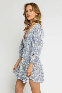 Chambray Eyelet Lace Puff Sleeve Mini Dress Spring V-neck Dress With Smocked Back, V-neck Mini Dress With Smocked Bodice For Daywear, Chic V-neck Eyelet Dress, Bohemian Mini Dress With Smocked Bodice And V-neck, Chic Eyelet V-neck Dress, V-neck Dress With Smocked Back For Day Out, Spring Lace Mini Dress With Smocked Bodice, Fitted V-neck Eyelet Dress, Summer V-neck Mini Dress With Broderie Anglaise