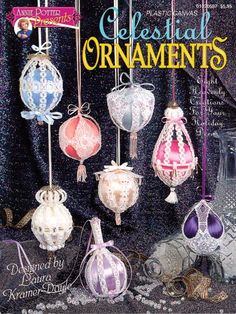 the cover of an ornament book with ornaments hanging from it's sides