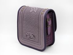 Introducing our Elegant Lavender Purple Crossbody Bag, a stylish and versatile leather handbag designed for the modern woman. Featuring one main section and a small pocket for your mobile phone, this bag ensures effortless organization and easy access to your essentials. The button securely fixes your keys, providing added convenience and peace of mind. The adjustable shoulder strap offers a length range of 47.2 to 31.5 inches (120 to 80 cm), ensuring comfort whether worn as a shoulder bag or a crossbody. Additionally, an extra strap is included for added versatility, allowing you to transform the bag to suit your needs. Here are the dimensions of the bag: External dimensions: 5.7 x 7.4 x 2.7 inches (14.5 x 19 x 7 cm) Internal dimensions: 5.5 x 7 x 2.5 inches (14 x 18 x 6.5 cm) Weight: App Purple Crossbody Phone Bag With Cell Phone Pocket, Daily Use Purple Crossbody Phone Bag, Purple Satchel Shoulder Bag For Office, Purple Travel Bag With Interior Card Slots, Purple Shoulder Bag With Mobile Phone Pocket For Travel, Purple Crossbody Shoulder Bag With Cell Phone Pocket, Purple Shoulder Bag With Removable Pouch For Office, Purple Bag With Interior Card Slots For Everyday Use, Purple Office Crossbody Shoulder Bag