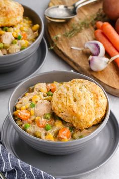 two bowls filled with chicken pot pies and carrots