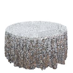 a round table covered in silver sequins