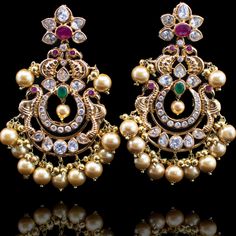 When design and imagination come together, the result is pure magic! Accessorize your look with this exquisite pair of earrings crafted with stones and pearl beads. Approximate earrings length is 3". Gold-plated on high-quality brass as base metal. In-stock & ready-to-ship.    *Please Note: We use faux stones and b Big Earrings Gold, Small Earrings Gold, Mom Earrings, Gold Jhumka Earrings, Gold Pearl Jewelry, Gold Earrings Models, Gold Earrings Wedding, Gold Pendant Jewelry, Black Beaded Jewelry