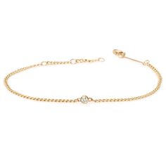 14k extra small hollow curb chain bracelet with a single bezel set diamond set in the chain SPECIFICS• 14k extra small hollow curb chain is 6-6.5-7" adjustable, chain is approx. 2mm wide• 3mm white diamond .10 ctw• available in yellow gold only• Lobster clasp closure***Please note curb chain bracelets can not be resized. Please make sure to order the correct size. Please view our bracelet size guide here. 14k Yellow Gold Cable Chain Diamond Bracelet, 14k Yellow Gold Diamond Bracelet With Cable Chain, Classic Diamond Bracelet With Chain, Classic 14k Gold Diamond Bracelet With Chain, Diamond Chain Bracelet With Adjustable Chain, Classic Diamond Chain Bracelet With Adjustable Chain, Classic Round Diamond Bracelet With Curb Chain, Elegant Diamond Curb Chain Jewelry, Yellow Gold Diamond Bracelet With Curb Chain