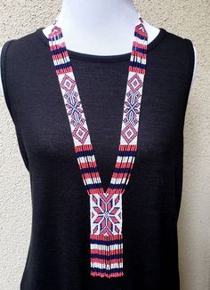 Colorful long Native American seed bead necklace with fun fringe in a striking pattern. This necklace says summer, beach, resort. Necklace measures 16 inches, pendant measures 4 1/2 inches from top to the bottom of the fringe. No clasp, just slip over your head. Striking with a swingy beach dress or a jean jacket. Shop more necklaces here: https://www.etsy.com/shop/BoutiqueByMaryam?section_id=21694658 Be sure to visit the rest of my shop here: https://www.etsy.com/shop/boutiquebymaryam Handmade Tassel Necklace With Round Beads For Beach, Beaded Tassel Necklaces With Round Beads For Beach, Beaded Tassel Necklace With Round Beads For Beach, Multicolor Tassel Necklace With Round Beads For Beach, Beaded Lariat Necklace For Festival, Bohemian Beaded Necklaces With Tassels For The Beach, Bohemian Lariat Beaded Necklace With Tassels, Handmade Bohemian Lariat Necklace For Summer, Adjustable Lariat Necklace For Summer Beach