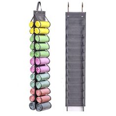 an over the door yoga mat rack holds several rolled up yoga mats in various colors