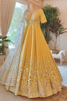 Yellow anarkali with all-over geometric motif mirror embellishments. Comes with embroidered dupatta.
Components:2
Embroidered
Neckline:Leaf
Sleeve Length:Long
Color:Yellow
Plunging neck - Aza Fashions Haldi Dress, Haldi Outfits, Wedding Lehenga Designs, Anarkali Dress Pattern, Traditional Indian Dress, Pakistani Fancy Dresses, Indian Dresses Traditional, Indian Bridal Dress, Indian Gowns Dresses