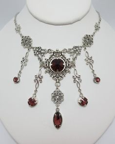 This is a new handmade necklace. It is made with antiqued silver plated filigrees, accented with high quality AMETHYST PURPLE glass jewels/rhinestones that sparkle like crystals. Decorated portion is 6 1/2" wide and 3 1/4" tall in the center. Necklace is adjustable 15-18" with a lobster clasp and chain extender. If you would like a different length, please send us a message.Matching earrings and headpiece are listed in our store. Shoulder Chain Jewelry, Medieval Steampunk, Outfit Reference, Steampunk Goth, Purple Gothic, Antique Silver Necklace, Grunge Accessories, Character Clothing, Choker Pendant