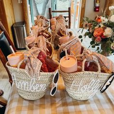 two baskets filled with food sitting on top of a wooden table next to a vase