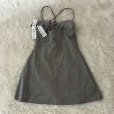 This Is A Brand New With Tags Gray Tennis Dress That Is Both Functional And Fashionable On The Court. I Am Moving To A Smaller Space So I Am Giving Away My Clothes. Casual Mini Dress With Built-in Bra, Casual Cotton Dress With Built-in Bra, Solid Mini Dress With Built-in Bra, Mini Dresses With Built-in Bra, Spring Dresses With Built-in Bra And Stretch, Solid Sleeveless Dress For Workout, Chic Sleeveless Workout Dress, Casual Solid Dresses For Workout, Stretch Dresses With Built-in Bra For Day Out