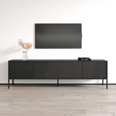 an entertainment center with a flat screen tv mounted on the wall