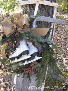 a christmas wreath with ice skates and pine cones