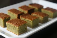 several pieces of cake on a white plate