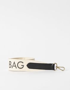 Made from a black cotton canvas, our canvas logo strap is here to make a statement with our O My Bag logo printed on one side. Featuring our signature brass clasps, you can attach this strap to almost any O My bag. Our personal favourite is the Audrey Mini x Shoulder Canvas Logo Strap combo. Slightly shorter than our regular webbing straps, this canvas logo strap measures 72 cm in length for an effortless on-the-shoulder look. Combine this strap with any O My Bag with a detachable strap. OMB-whi White Shoulder Bag With Logo Strap For Everyday, Everyday White Shoulder Bag With Logo Strap, Adjustable Logo Strap Travel Bag, Beige Logo Shoulder Strap For Everyday Use, Adjustable Crossbody Bag With Logo Strap, Travel Bags With Adjustable Logo Strap, Canvas Bags With Logo Strap For Travel, Travel Canvas Bag With Logo Strap, Trendy Black Bag Strap For Everyday