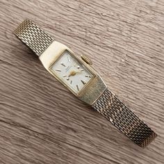 Vintage ladies 10K gold filled watch from luxury Swiss watch maker Girard Perregaux circa 1960s. Very rare elegant ladies wrist watch. Dial with gold hands and gold hour markers. All the hours are marked by ticks. Movement Jewels: 17. Swiss made. Case Back Signed: 10K G.F. (Gold Filled) - G/P. Case Serial No: B2268. Band: Kestenmade 1/20 10K GF USA, PAT. No 3,319,308. Measures: 8 mm x 12 mm (dial) x 6 mm (thickness). Width: 12 mm with crown. Weight: 0.6 oz. Vintage Girard Perregaux watch is in good pre-owned condition. Has a little scratch on the crystal. Winds, sets and runs. It's a nice addition to any watch collection. Vintage Gold Watch Swisswatchexpo, Tiny Watch, Lady Watches, Ladies Wrist Watch, Girard Perregaux, Vintage Watches Women, Swiss Watch, Watch Dial, Vintage Lady