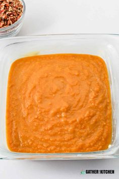 a glass casserole dish filled with carrot dip