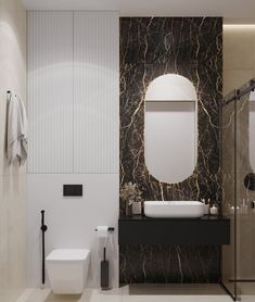 a modern bathroom with black and white marble wallpaper, sink, toilet and shower