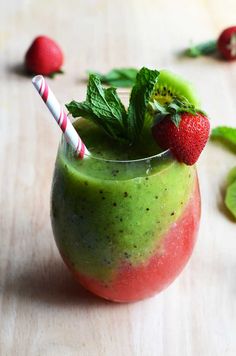 a green smoothie with strawberries and mint