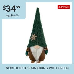 a stuffed animal with a green hat and snowflake on it's head